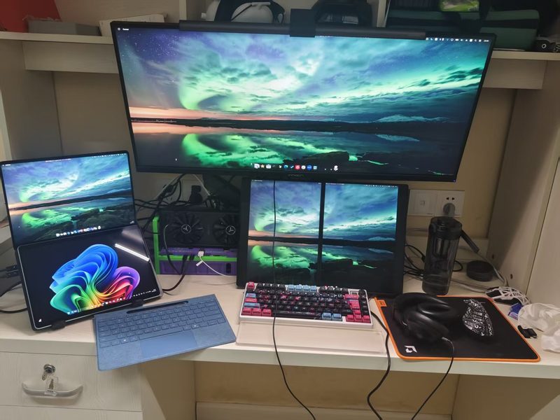 Dorm desk with a Surface Pro, dual portable screens and an external GPU
