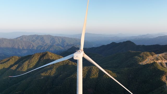 Close-up of a wind turbine in golden light