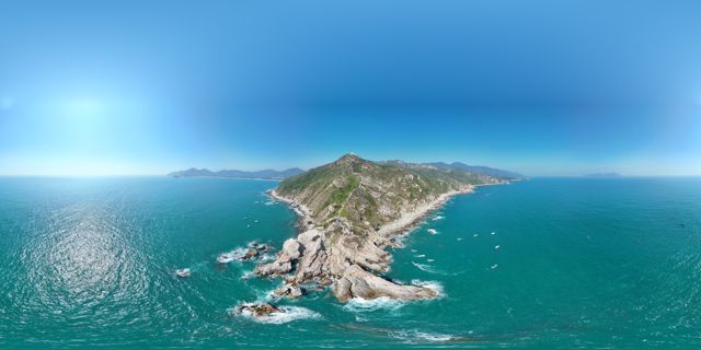 Panorama of a rocky cape surrounded by sea