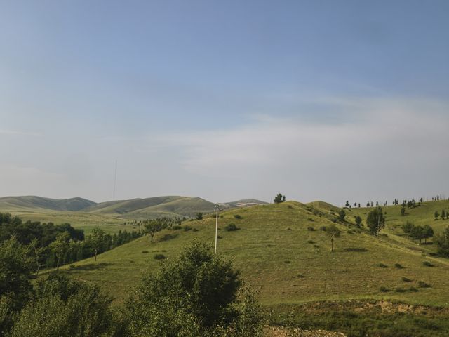 Green rolling grassland hills